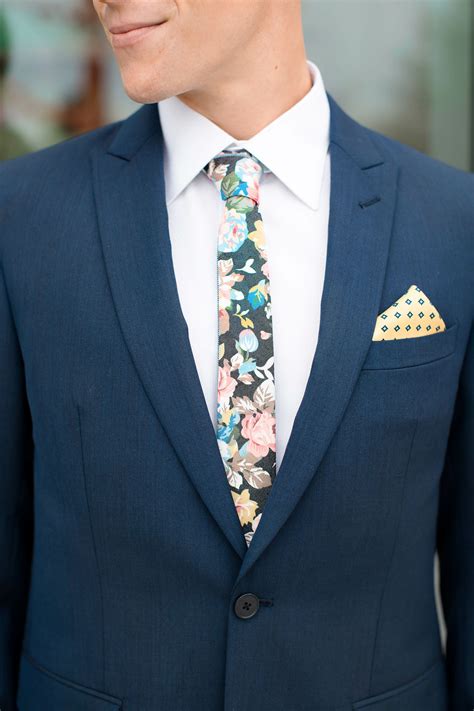 floral ties with navy suit.